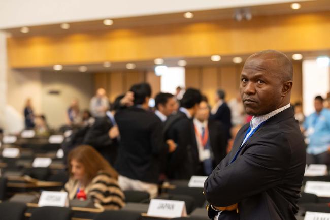 Exhausted delegates arrive in plenary and react to the outcome