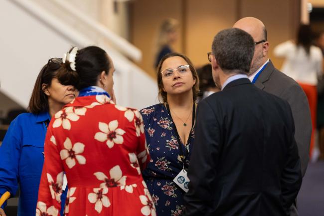 Delegates from Uruguay and Mexico consult