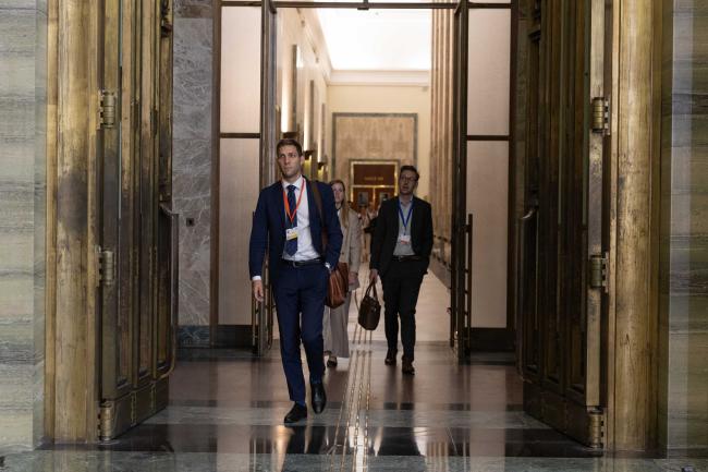 After working through the night, Heads of Delegation arrive for closing plenary