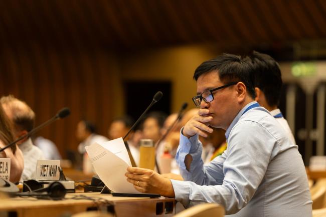 Delegates refer to the draft negotiating text