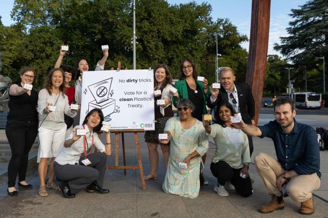 Members of civil society hand out bars of soap to delegates as they arrive at the venue, calling for a 'clean' plastics treaty with 'no dirty tricks'