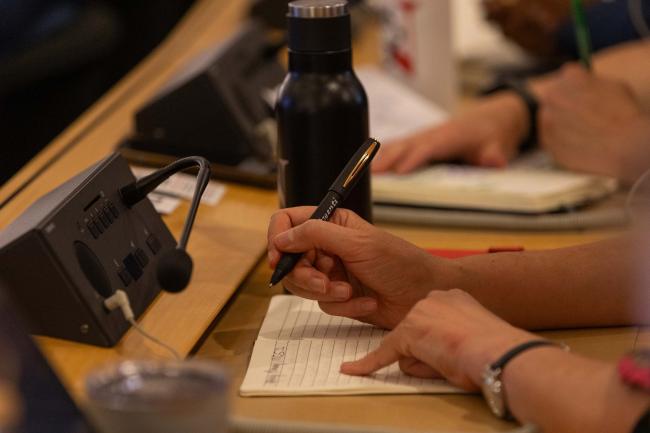 Delegate takes notes