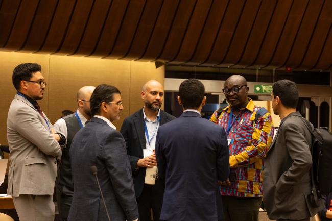 Contact Group 2 Co-Chair Peter Justice Dery, Ghana, consults with delegates