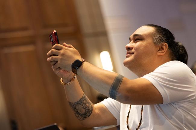 Delegates take photos