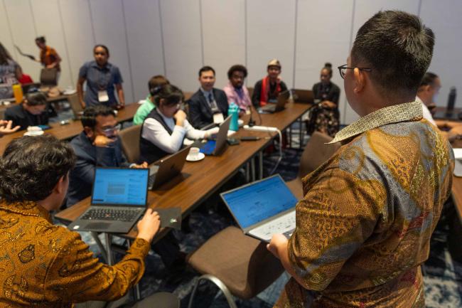 Participants break out into small groups to discuss, refine, and finalize the Youth Manifesto