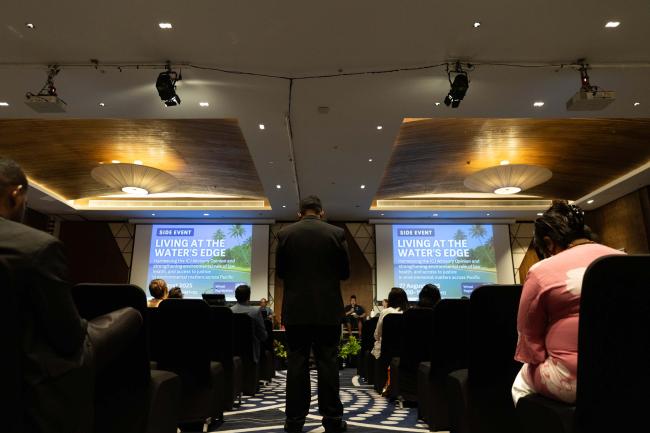 Delegates attend the side event "Living at the Water's Edge" 