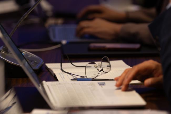 Delegates conclude the day by adopting the meeting report