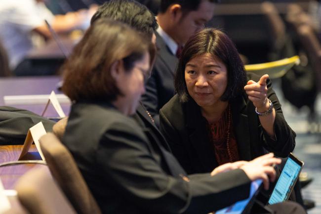 Delegates consult