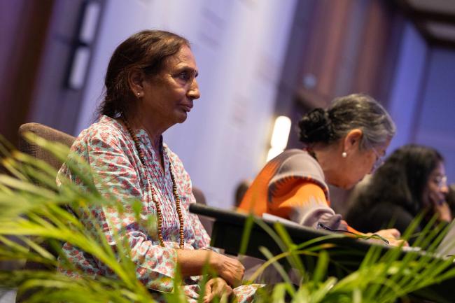 Delegates listen to the interventions