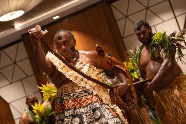 Kava, the traditional drink of Fiji, is brought in for the ceremony