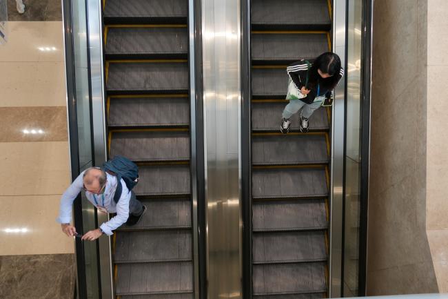 Participants going up and down the stairs to the different activities at the conference