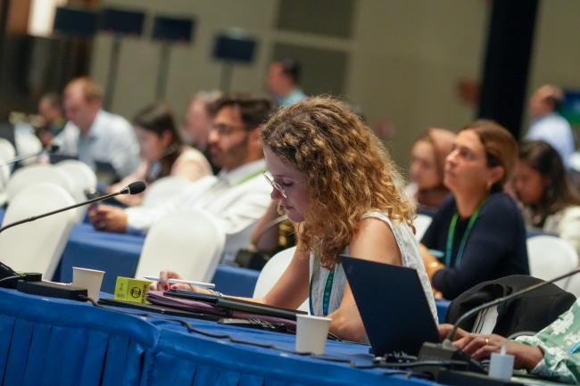 Participant taking notes during event