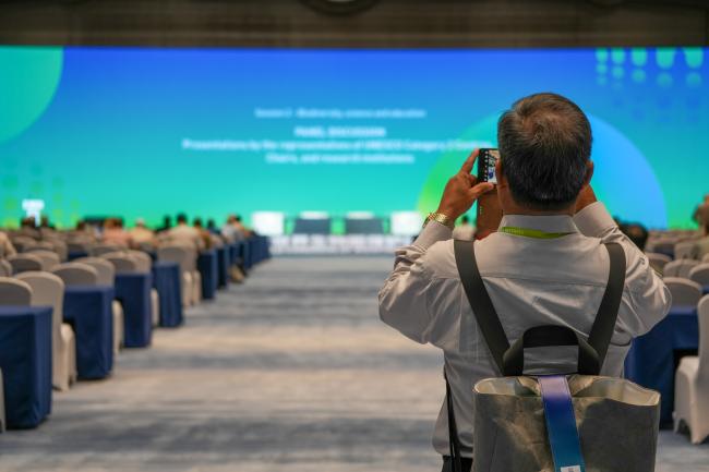 Participant taking a picture from the podium