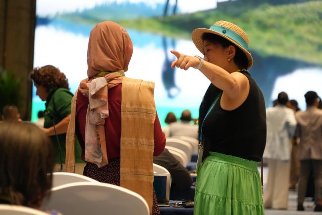 Participants talking casually before the session