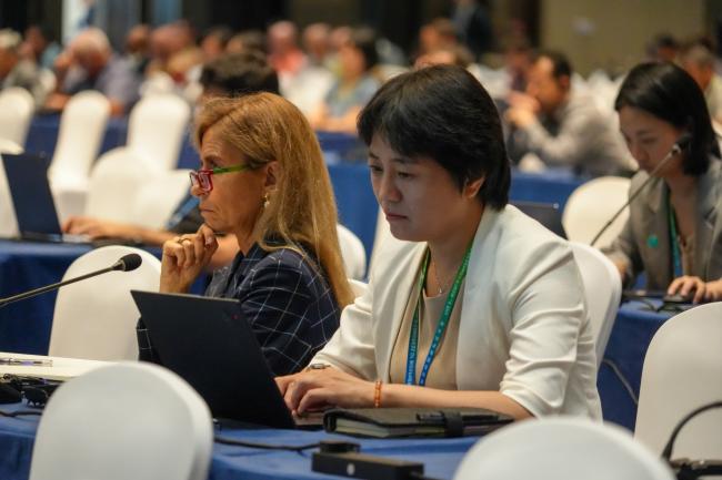 Participants listening the to the podium