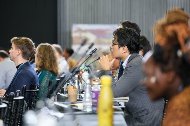 Delegates follow the session 