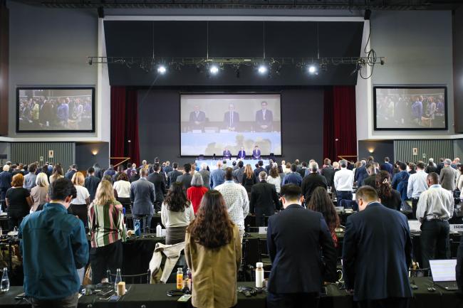 Delegates observe a minute of silence for the victims of the disaster caused by the hurricane in Jamaica and Haiti. 