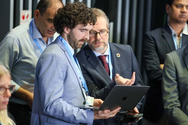 Delegates from Germany consult. 