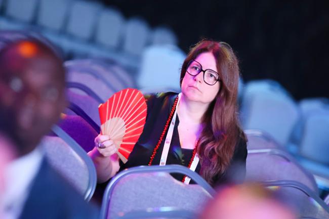 Participant holding a fan 