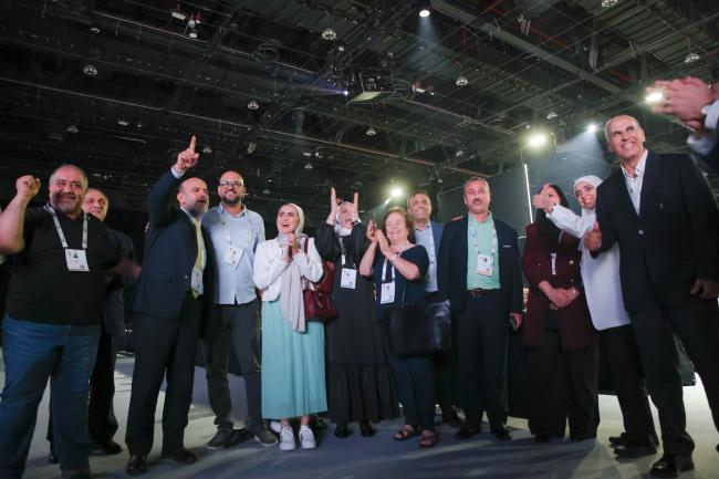 Participants celebrate the election of the new IUCN Council. 