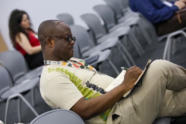 A participant takes notes 