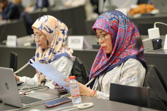 Delegates read the agenda