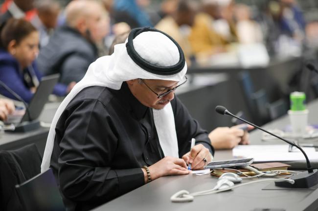 A delegate takes notes 
