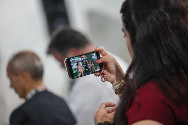 A participant takes a picture 