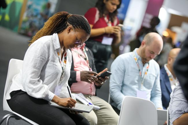 A participant takes notes.