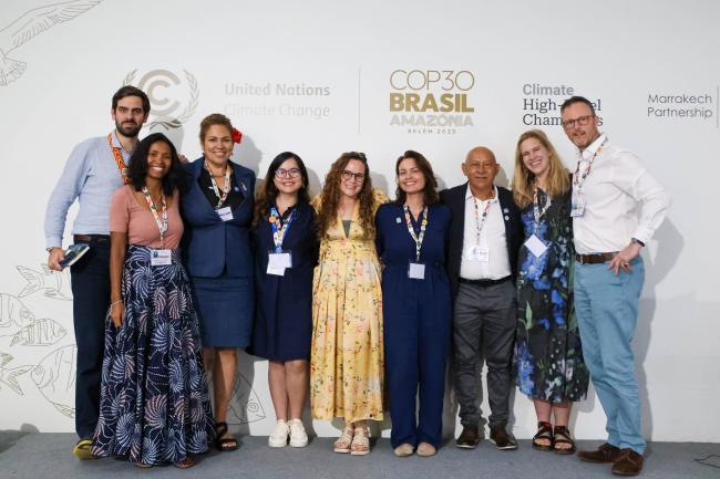 Panelists and organisers pose for a group photo at the end of the event. 