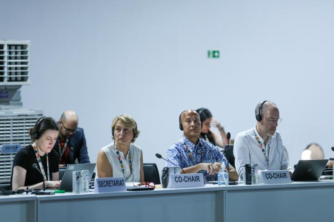 From L-R: Ana Vukoje, UNFCCC Secretariat; Just transition work programme contact group Co-Facilitators Federica Fricano, Italy, and Joseph Teo, Singapore; and Damon Jones, UNFCCC Secretariat