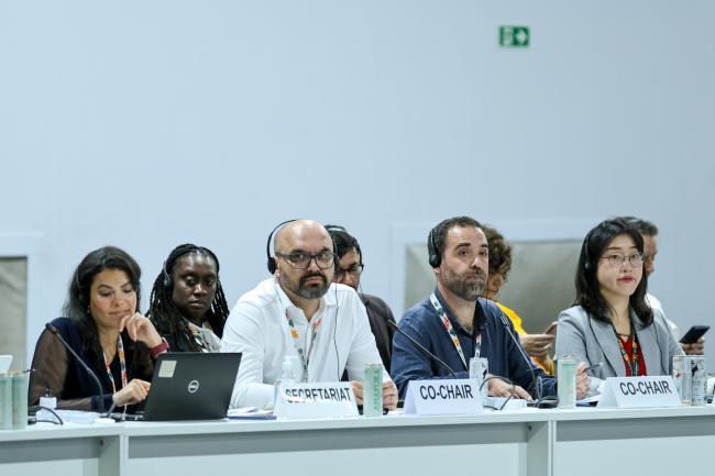 From L-R: Fatin Tawfig, UNFCCC Secretariat; Co-Facilitators for informal consultations on the Loss and Damage Fund Jose Delgado, Austria, and Daniel Lund, Fiji; and Hyesu Yoon, UNFCCC Secretariat