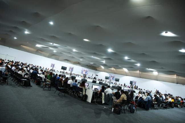 View of the room during informal negotiations on Article 6.8 of the Paris Agreement