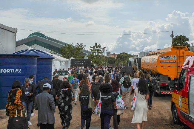 Participants evacuating the venue through side exits