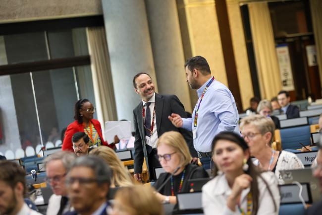 Delegates share a moment of laughter. 