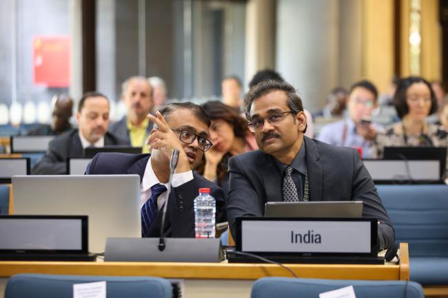 Delegates from India consult. 
