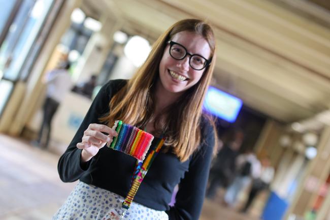 Shellan Saling displays a 15-year-old plastic lanyard showing no signs of degradation. 