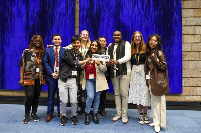 Members of Children and Youth Major Group pose for a family picture. 