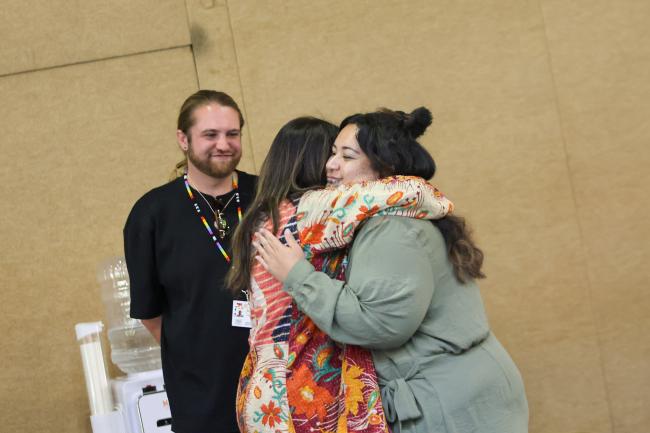 Delegates hug 