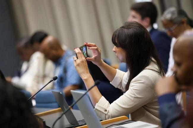 A participant takes a picture 