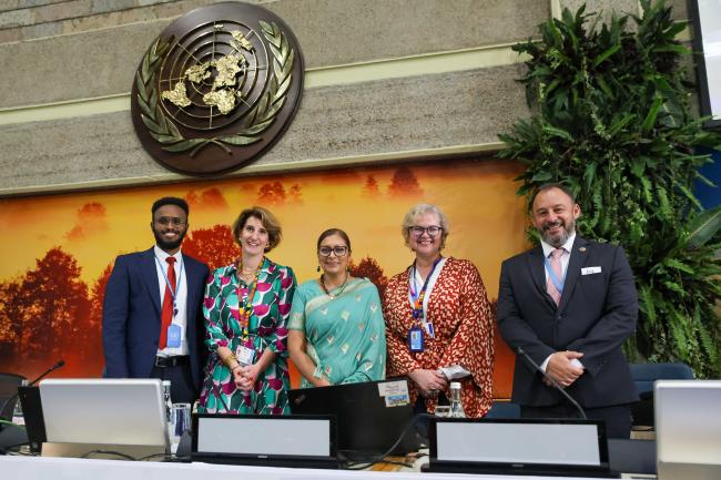 Members of the Secretariat pose for a family photo to celebrate Radhika Ochalik's birthday. 