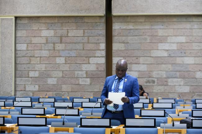 A delegate reads 