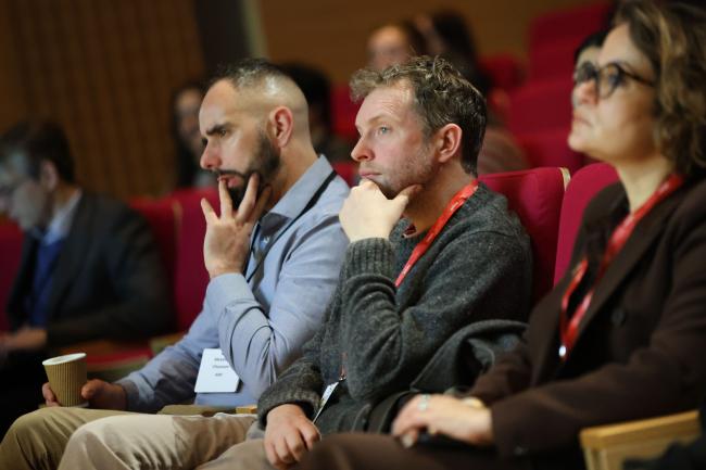 Participants listen to the panelists. 