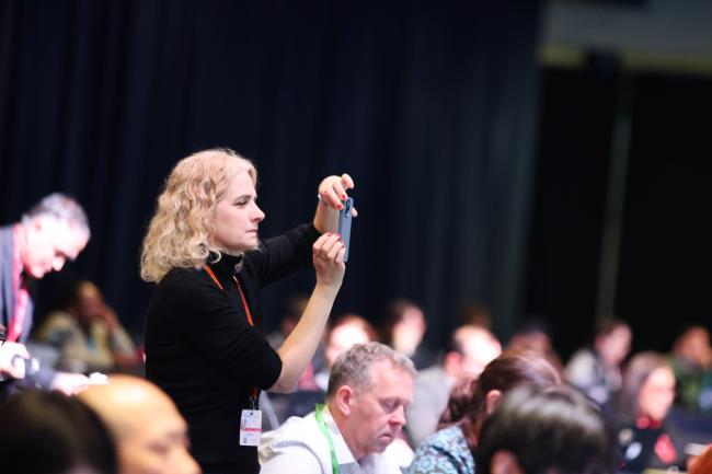 A delegate takes a picture