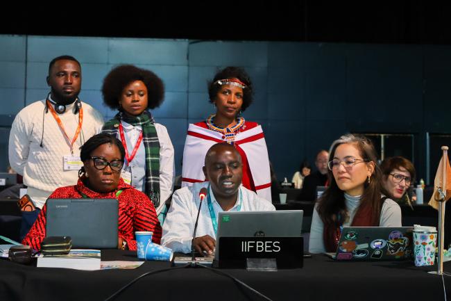Gathuru Mburu (center) and representatives of the International Indigenous Forum on Biodiversity and Ecosystem Services (IIFBES)