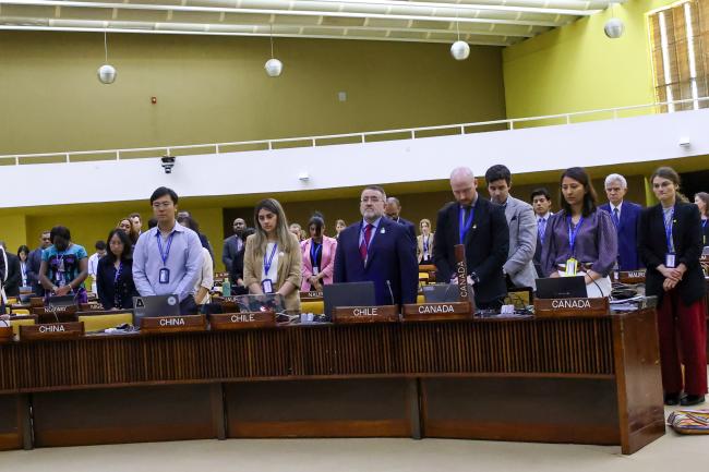 Delegates observe a minute of silence for Juan José González Mijares, Mexico and ISA-28 Council President, who passed away earlier today, 13 March 2026. 