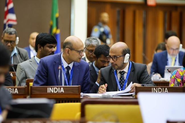 Delegates from India consult.