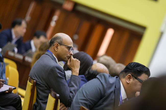 Delegates listen to the discussions 