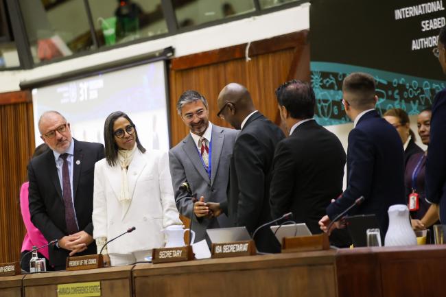 Outgoing Council President Duncan Muhumuza Laki, Uganda, gives the gavel to Newly Elected Council President Mayank Joshi, India. 