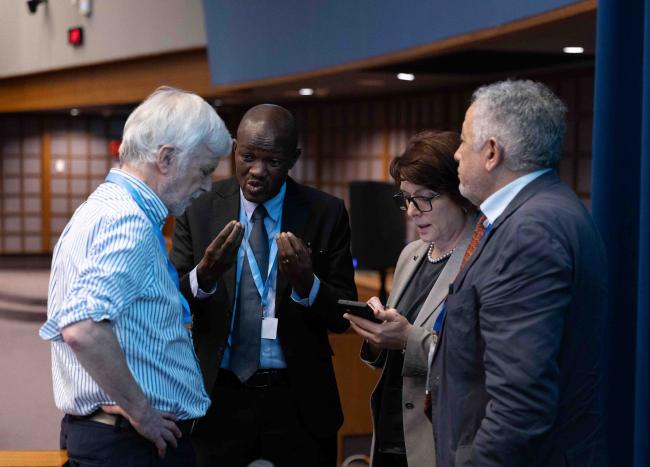 IPCC Chair Jim Skea, consults with IPCC Vice-Chair Ladislaus Chang'a, IPCC Deputy Secretary Ermira Fida and IPCC Secretary  Abdalah Mokssit 